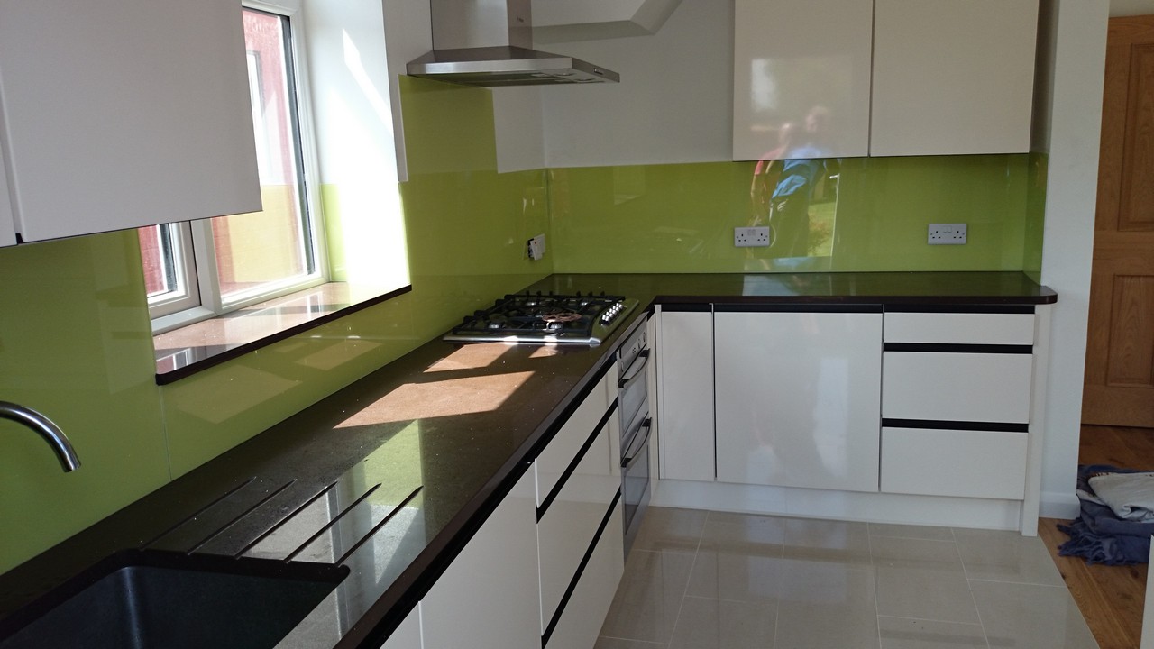 Lime green glass kitchen splashback installed by Brockley glaziers